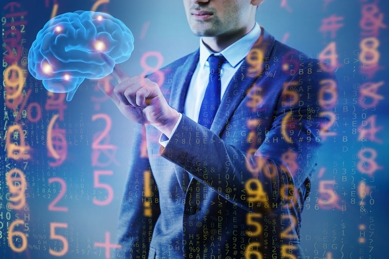 man touching floating brain with coding around it